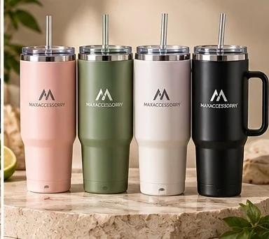 Straw tumblers in pink, green, white and black with metal straws